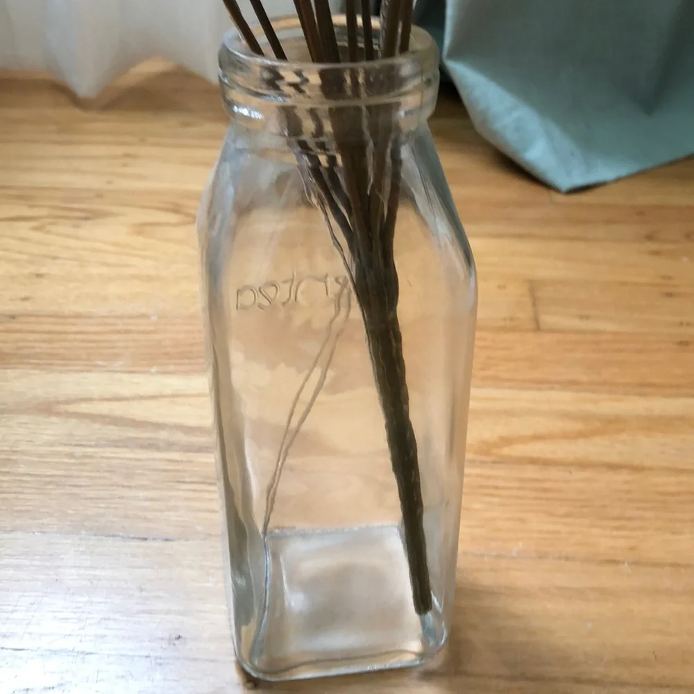 Faux sunflower florals with jewels in milk jar